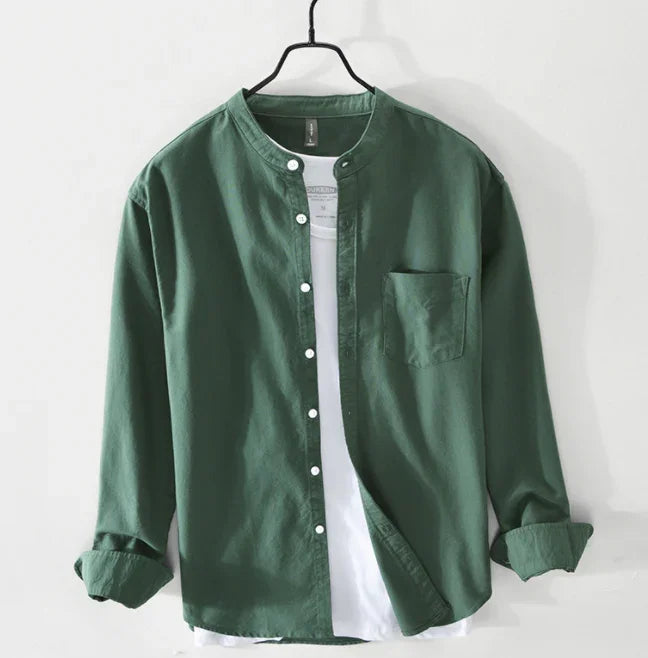 Green long-sleeve button-up shirt with mandarin collar layered over white t-shirt on hanger