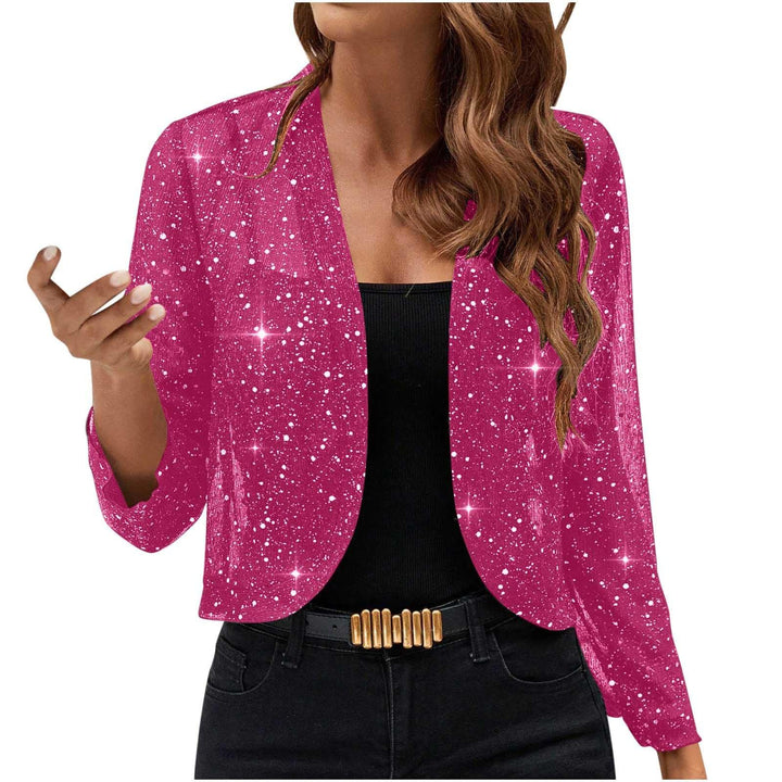 woman wearing pink glitter sparkle open front blazer over black top with gold buckle belt