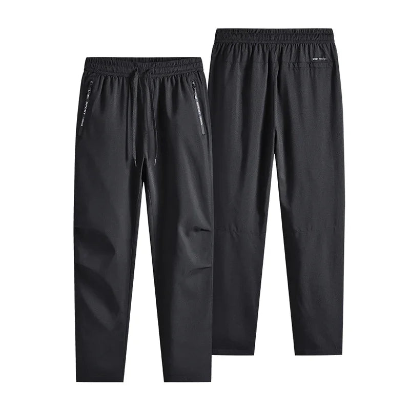Black casual men's jogger pants with elastic waistband and zipper pockets front and back view