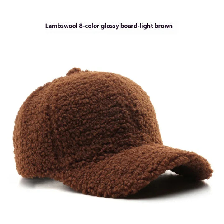 Light brown lambswool textured baseball cap with curved brim on white background