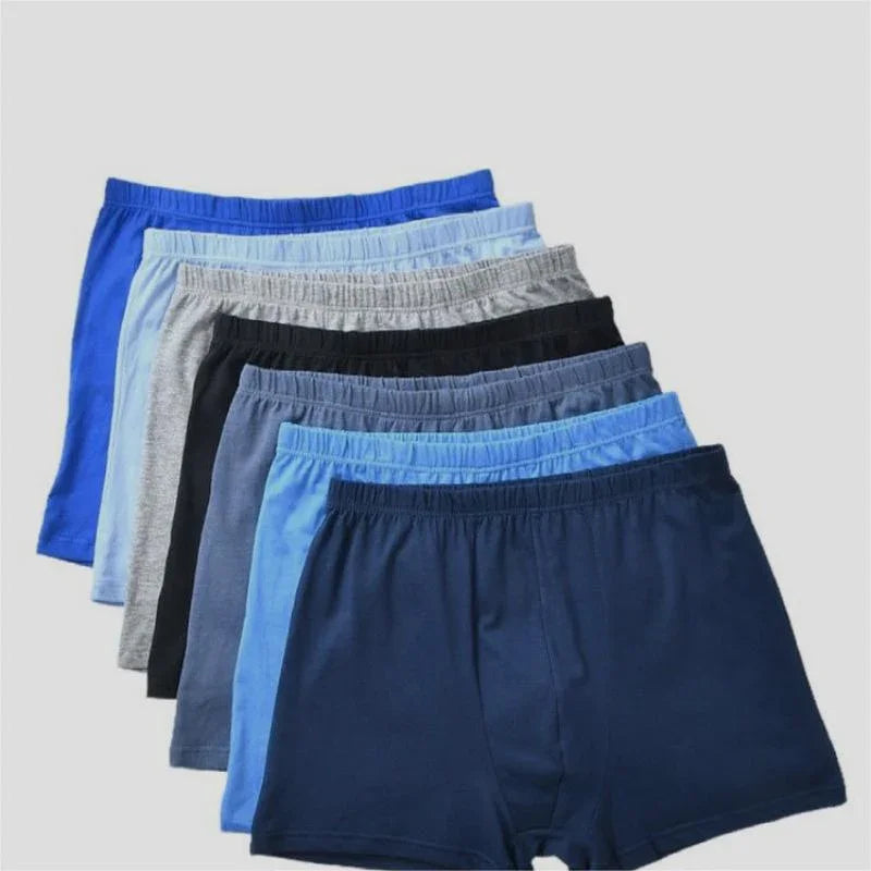 Pack of men's cotton boxer briefs in shades of blue, gray, and black with elastic waistbands