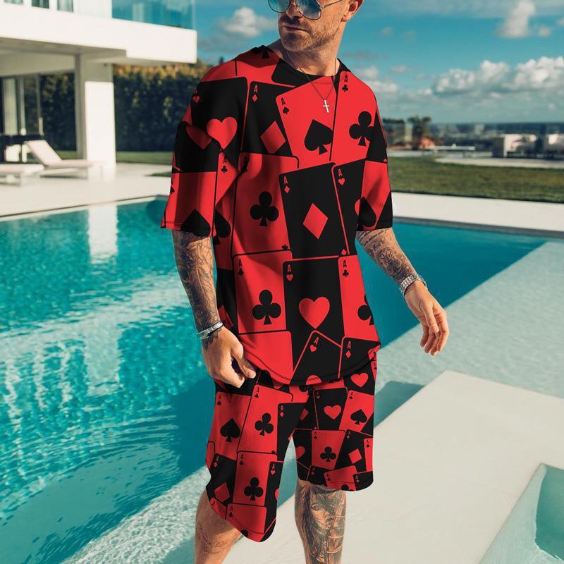 Man wearing red and black playing card print matching T-shirt and shorts set by poolside