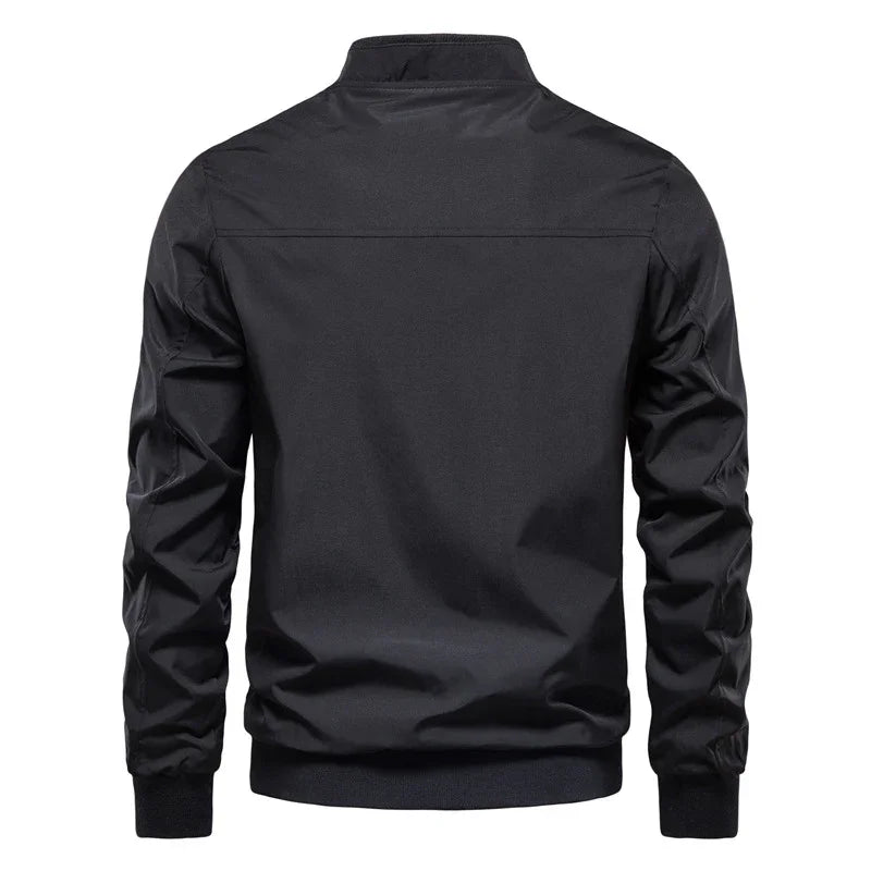 Back view of a black casual men's bomber jacket with ribbed cuffs and waistband