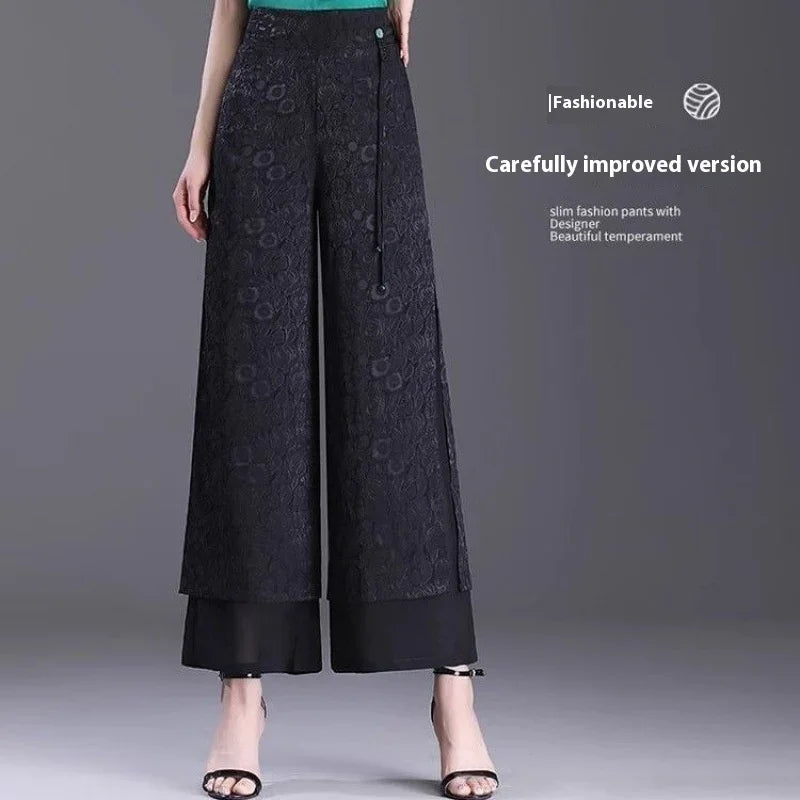 Fashionable black wide-leg lace pants with inner lining and ankle-strap heels on model
