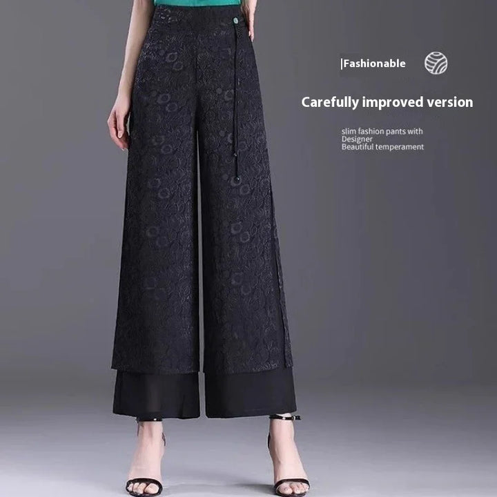 Fashionable black wide-leg lace pants with inner lining and ankle-strap heels on model