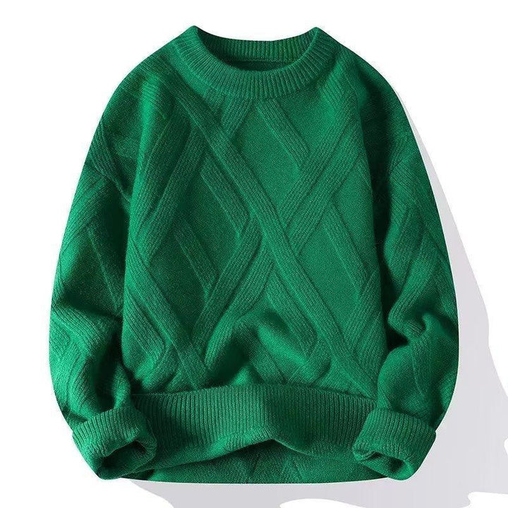 Green cable knit sweater with ribbed cuffs and hem, displayed on white background