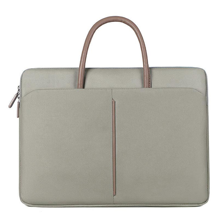 Minimalist grey laptop bag with brown handles and front zipper pocket
