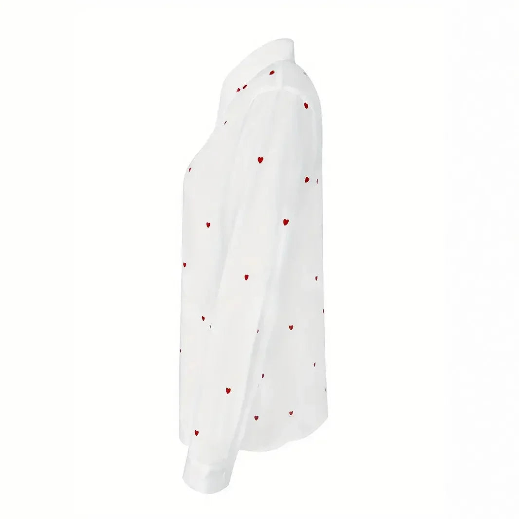 White long-sleeve button-up shirt with red heart pattern, side view, fashion top