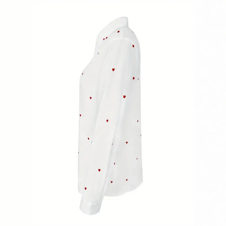 White long-sleeve button-up shirt with red heart pattern, side view, fashion top