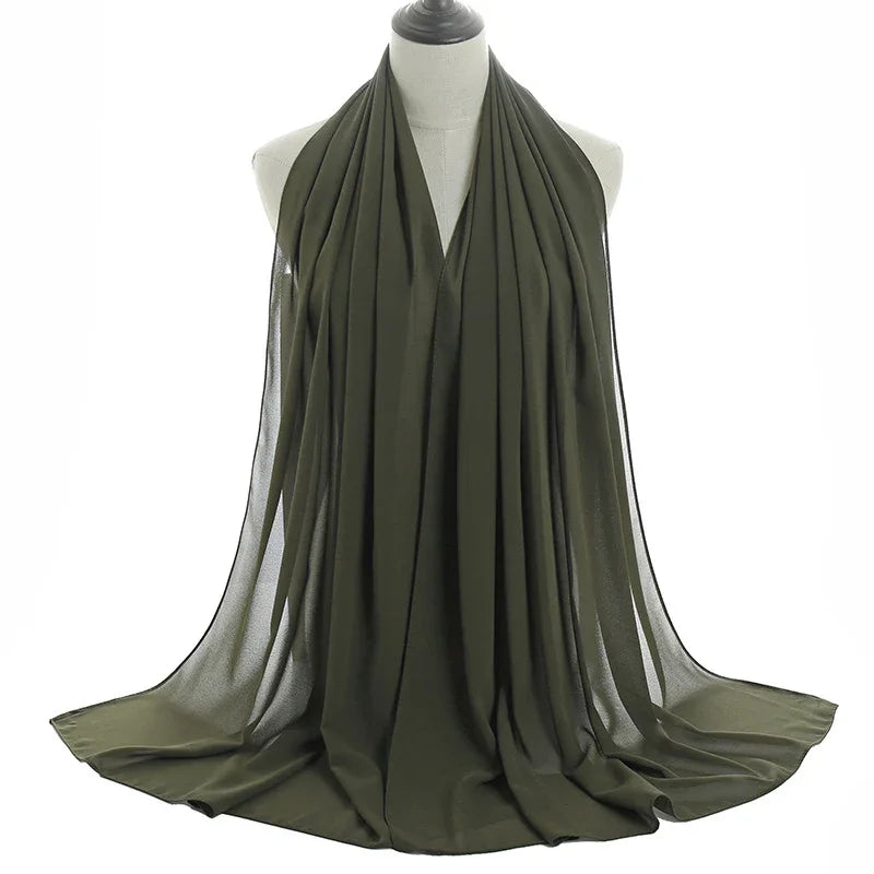 olive green chiffon hijab scarf draped on mannequin with soft, flowing fabric