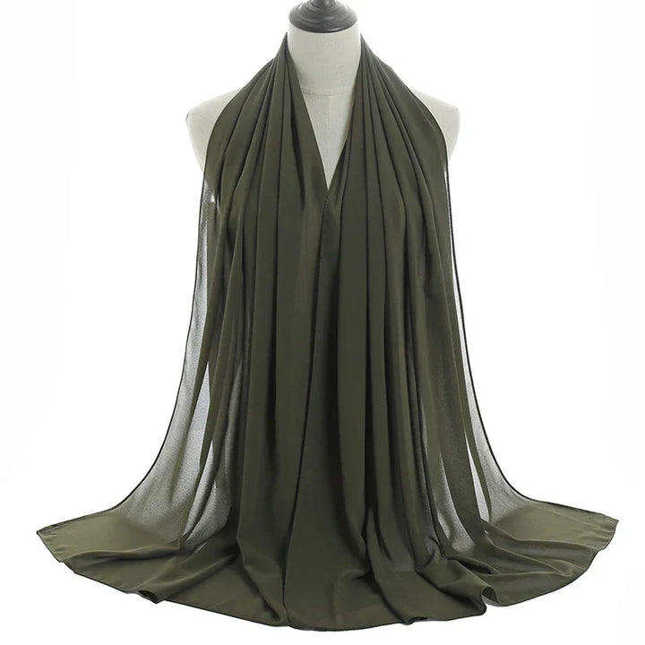 olive green chiffon hijab scarf draped on mannequin with soft, flowing fabric