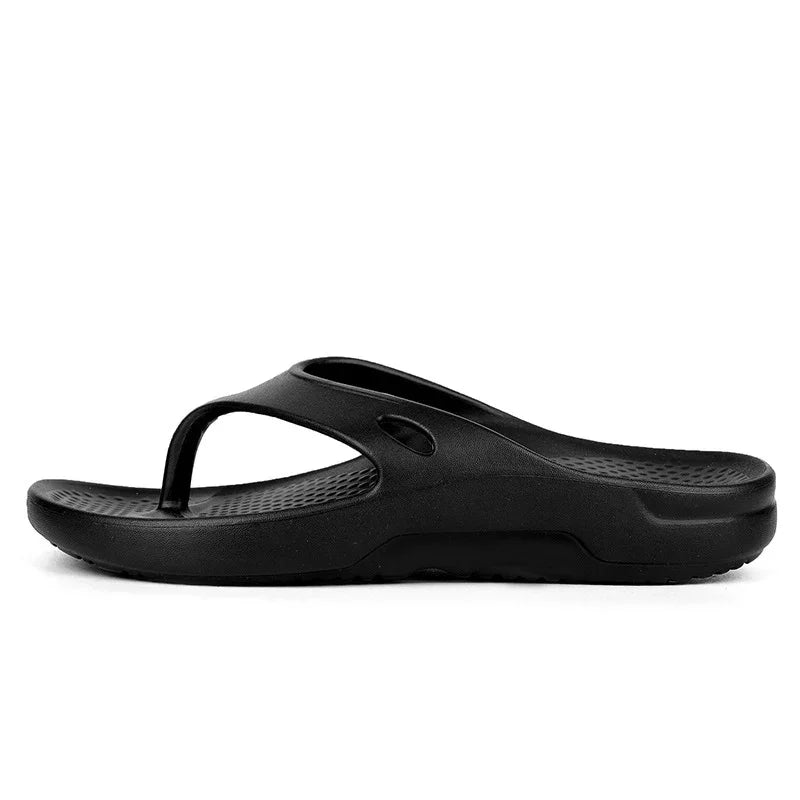 black ergonomic men's thong sandal with textured footbed and cushioned sole on white background