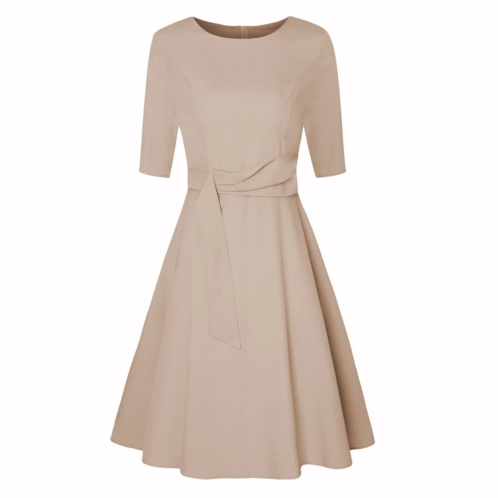 Beige knee-length dress with half sleeves, boat neckline, fitted waist, and flared skirt