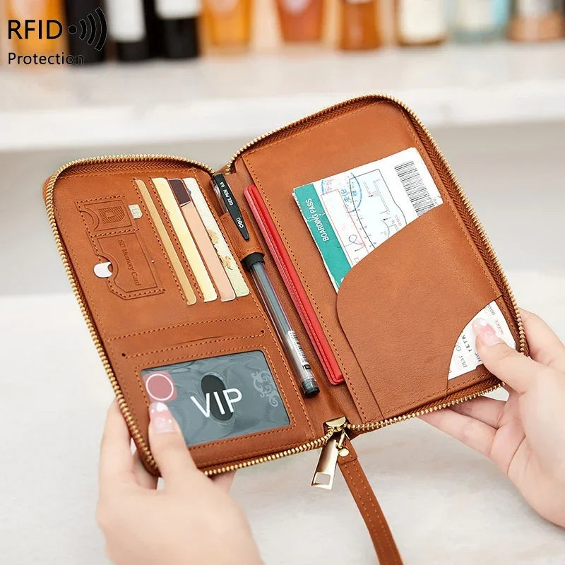 Brown leather RFID protection travel wallet with card slots, pen holder, and boarding pass pocket