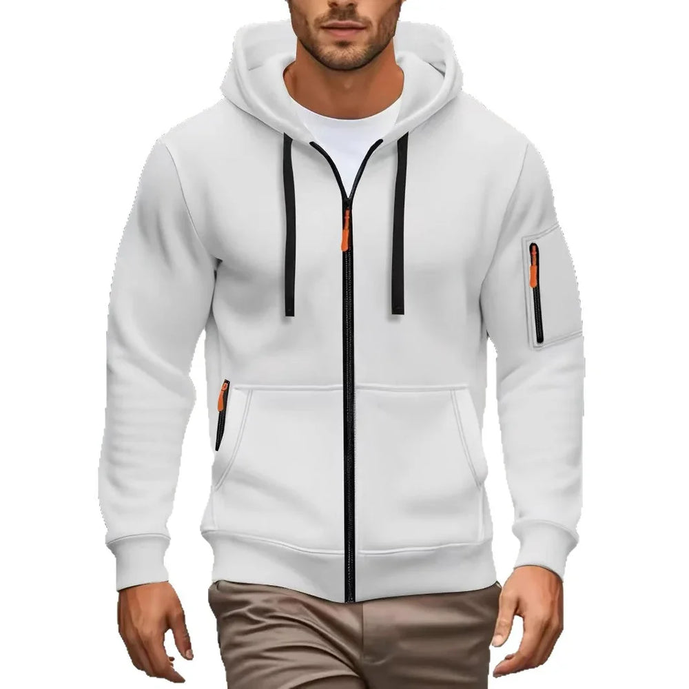 Man wearing white zip-up hoodie with black zippers and orange pulls, paired with brown pants