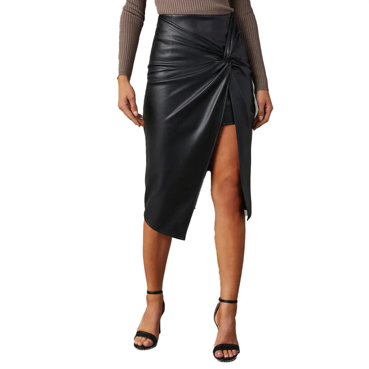 Woman wearing black faux leather asymmetrical midi skirt with front slit and gathered detail