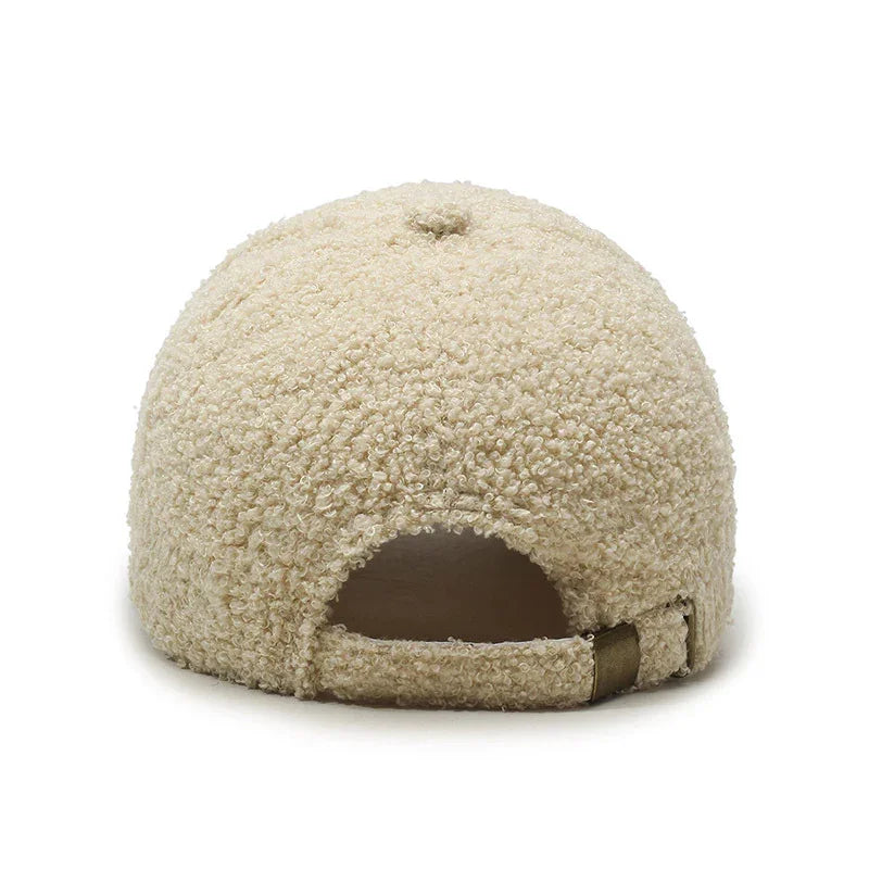 Beige textured boucle fabric baseball cap shown from the back with adjustable strap