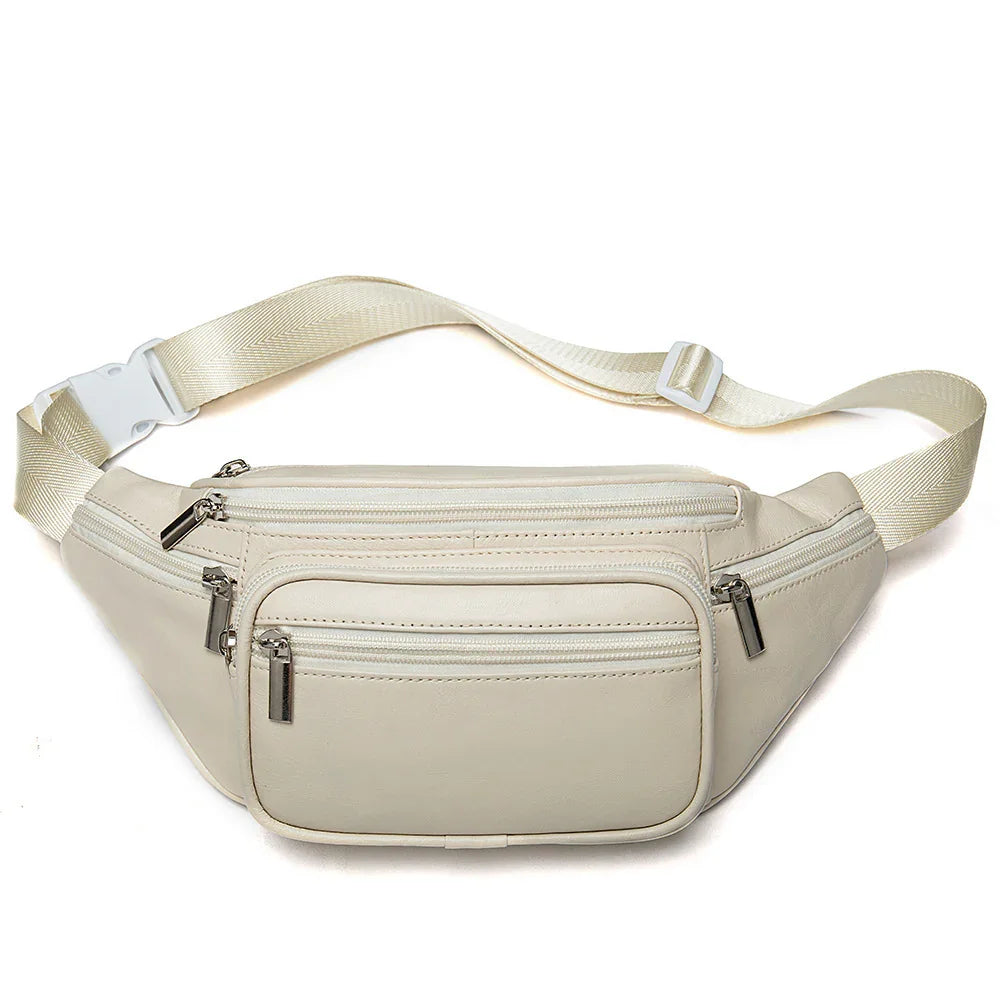 Beige leather waist bag with multiple zippered compartments and adjustable strap