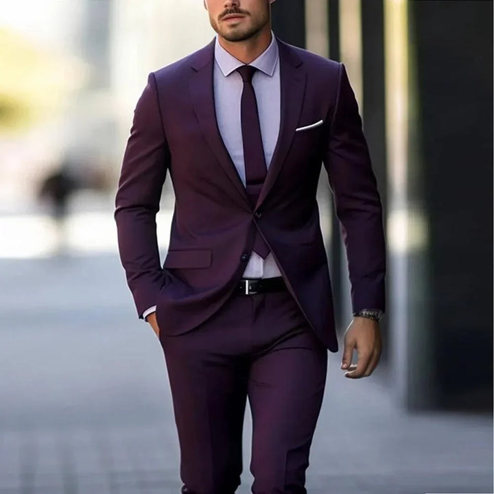 Man wearing slim fit purple business suit with matching tie and light blue dress shirt walking outdoors