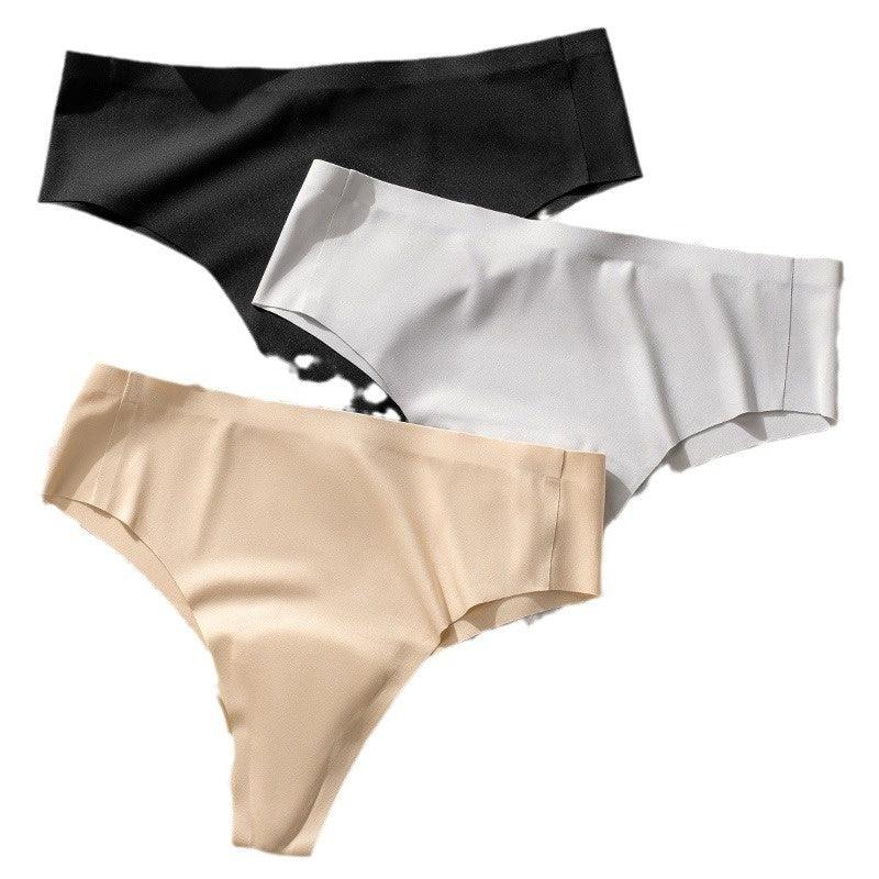 Three seamless women's panties in black, white, and beige on white background