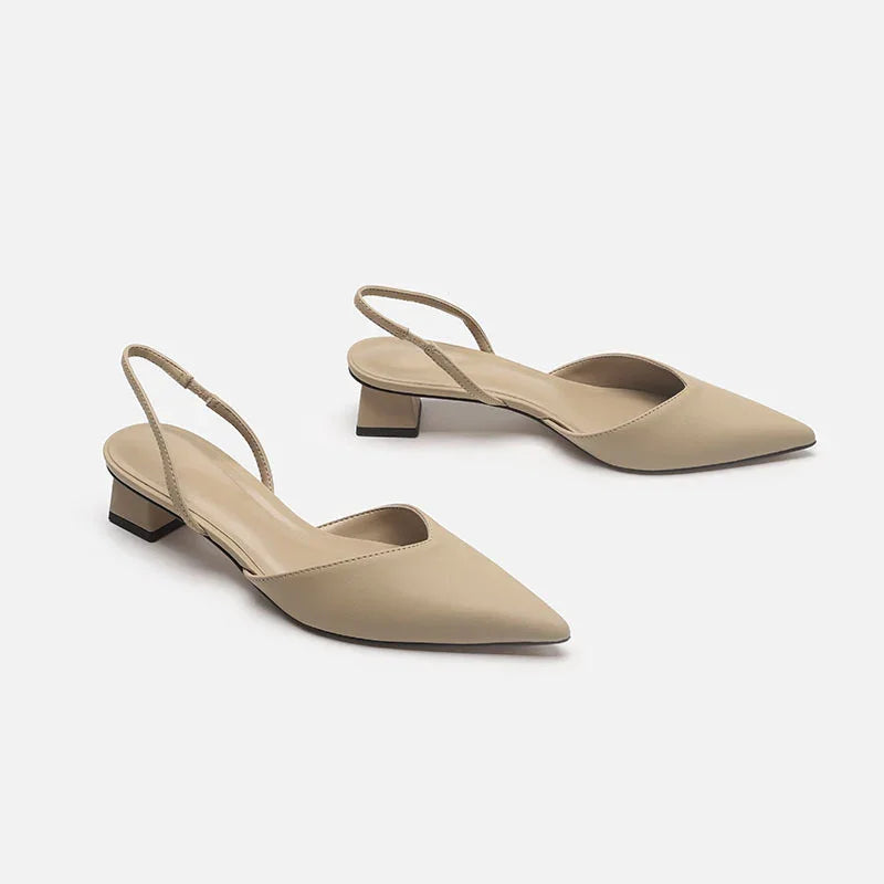 Beige pointed-toe slingback low heel women’s shoes on white background