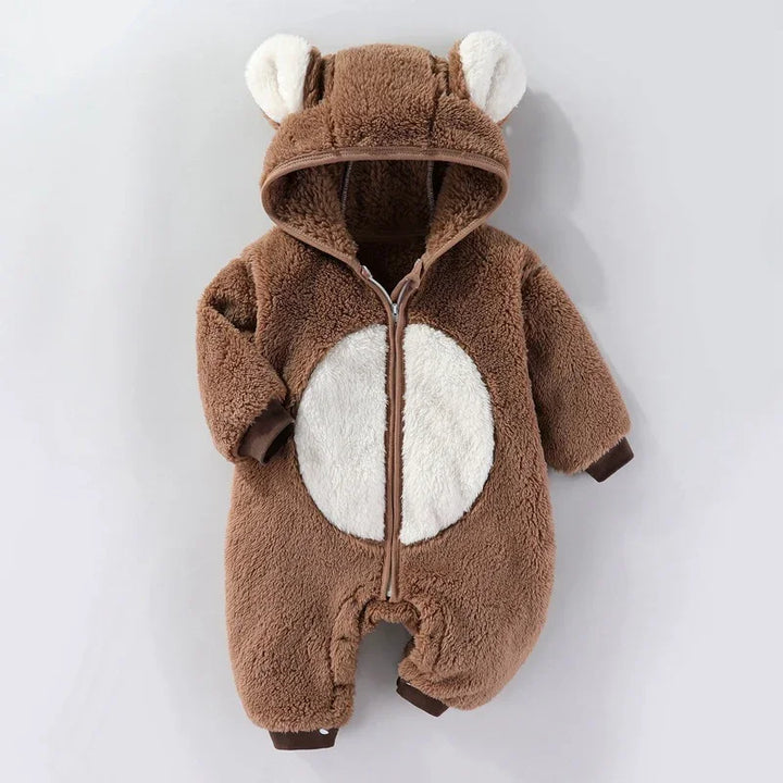 Brown fuzzy baby romper with hood and white belly patch, featuring bear ears on hood
