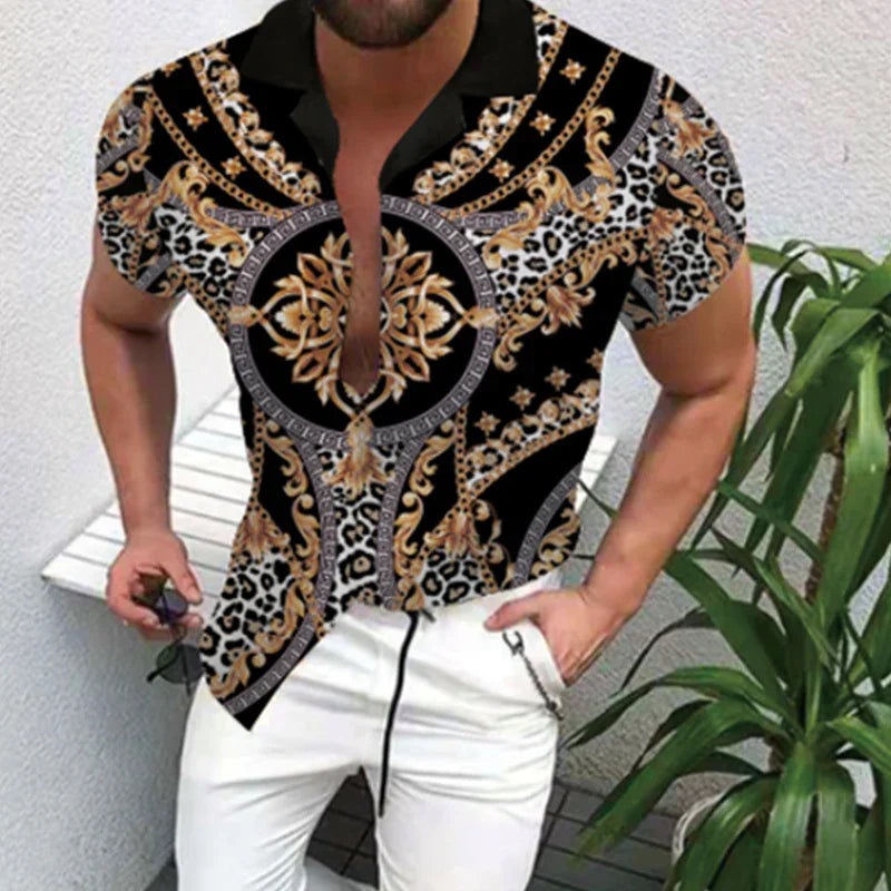 Stylish man wearing black and gold baroque print shirt with leopard details and white pants, holding sunglasses