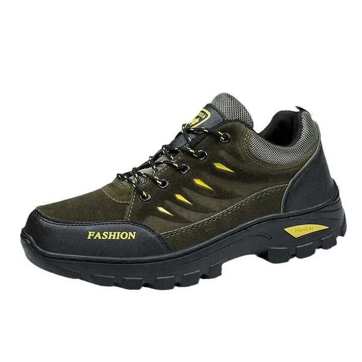 Black and olive green rugged fashion sneaker with yellow accents and thick tread sole