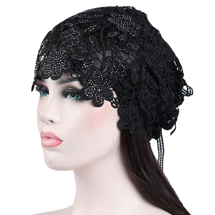 Black floral lace headscarf with rhinestone details on mannequin head