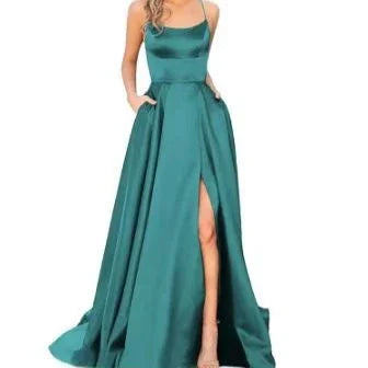 Woman wearing elegant teal satin evening gown with spaghetti straps and thigh-high slit