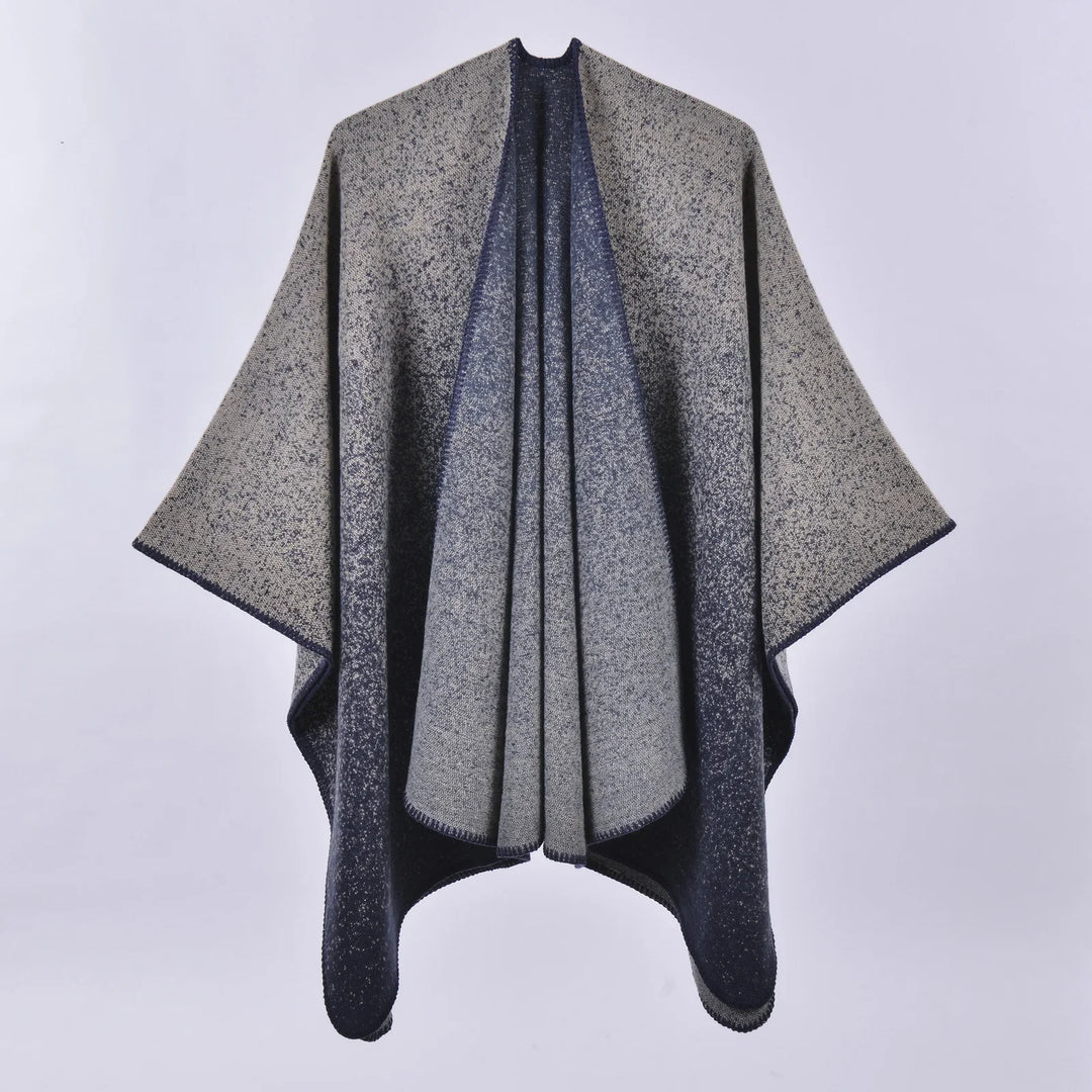 Grey and navy blue speckled wool poncho with wide sleeves, displayed on white background