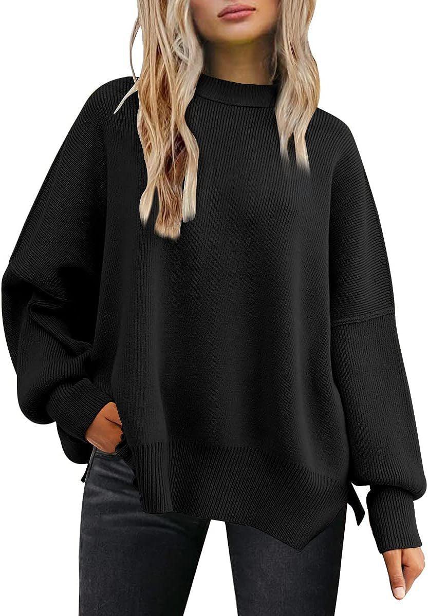 woman wearing loose black ribbed knit sweater with asymmetrical hem and long sleeves