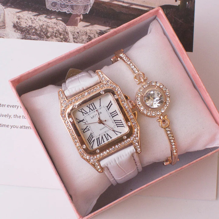 Elegant white leather watch with gold rhinestone bezel and matching rhinestone bracelet in pink box