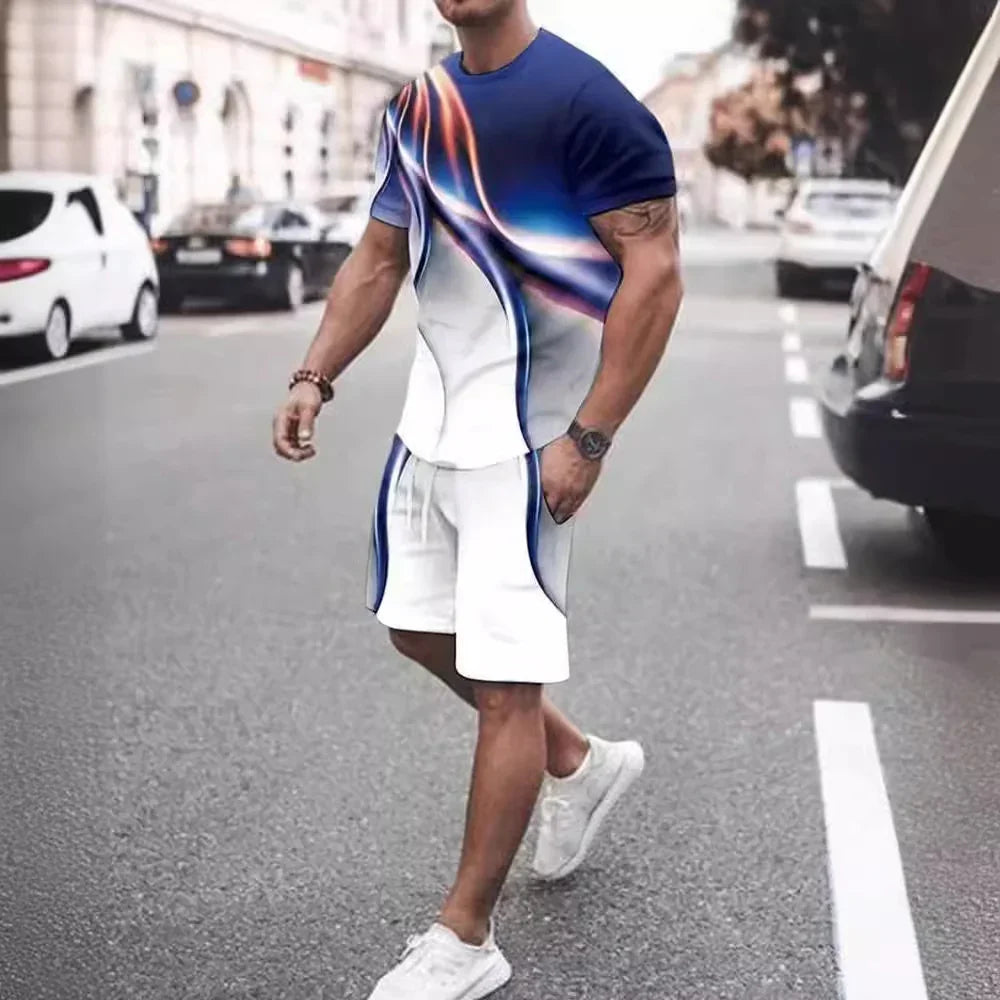 Man walking on street wearing white and blue abstract print short sleeve shirt and matching shorts with white sneakers