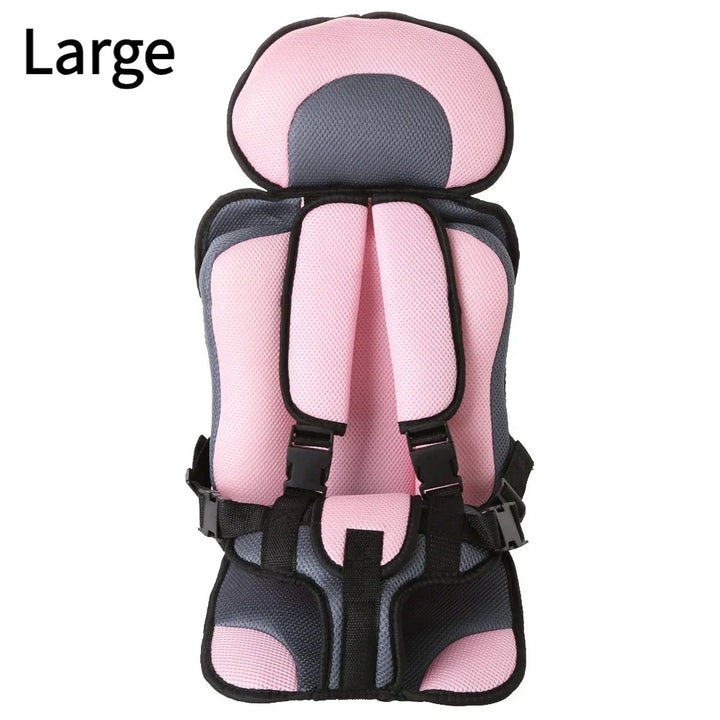 Large pink and gray padded child safety car seat with adjustable straps and headrest