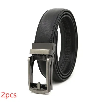 black leather men's belt with silver automatic buckle, rolled and standing on white background