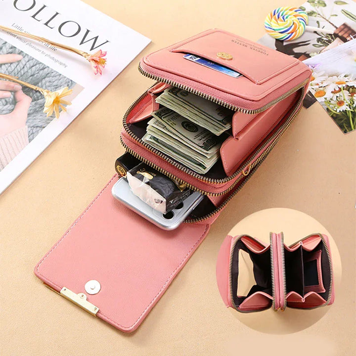 Pink leather wallet with multiple compartments holding cash, cards, and a smartphone on a beige surface