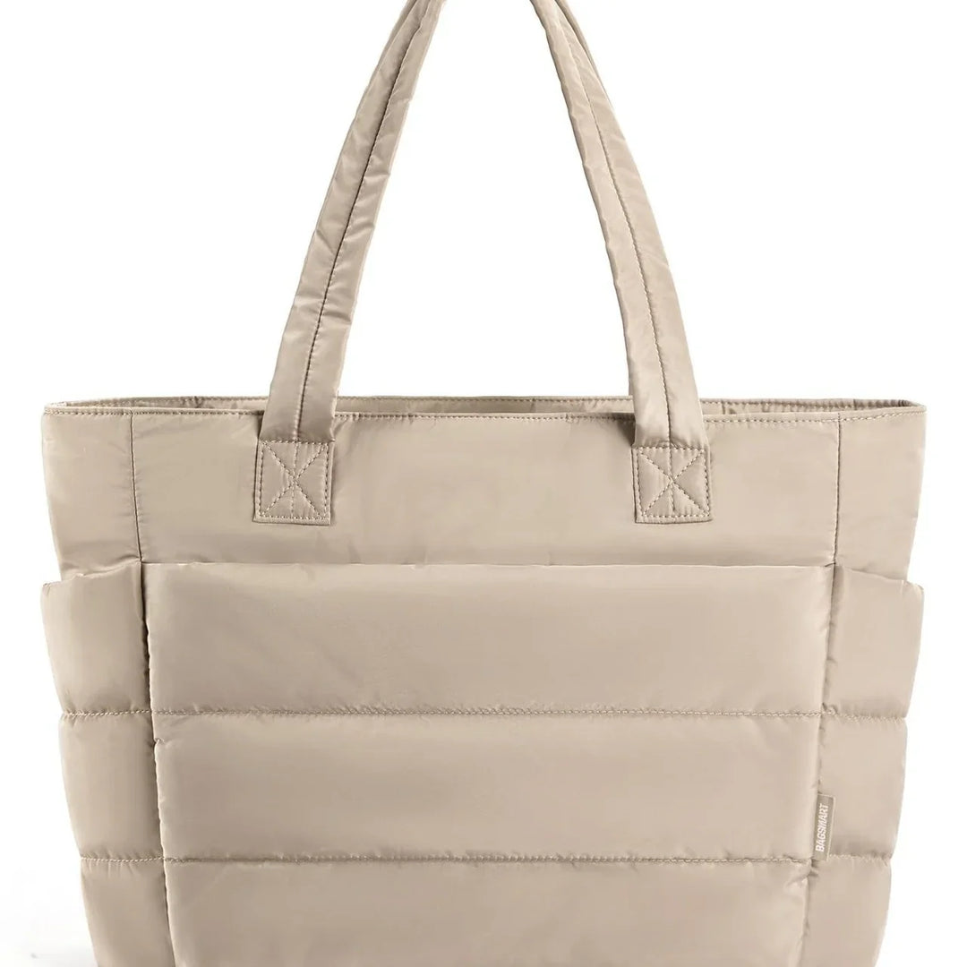 Beige padded tote handbag with double handles and quilted stitching
