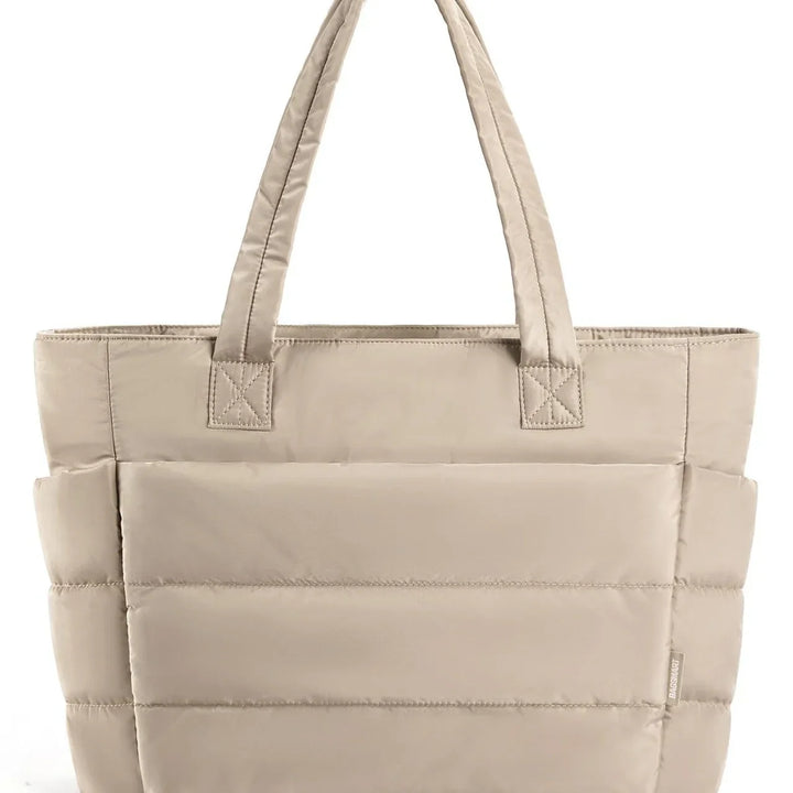Beige padded tote handbag with double handles and quilted stitching
