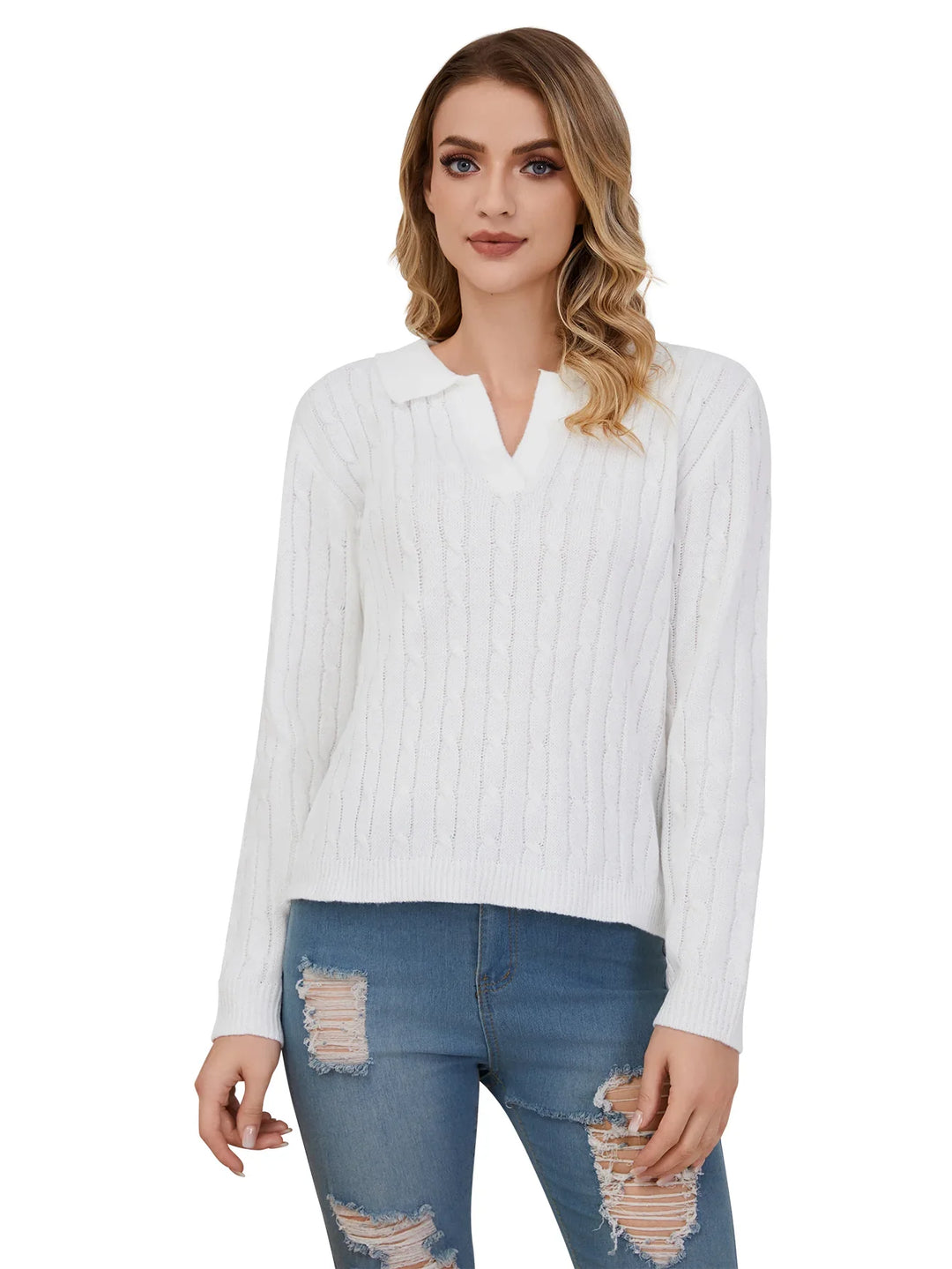 Woman wearing a white cable knit sweater and ripped blue jeans on white background