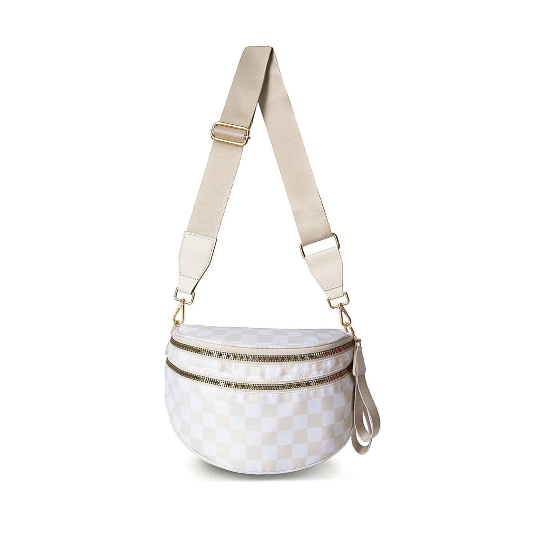 White checkered crossbody bag with two gold zippers and adjustable beige strap