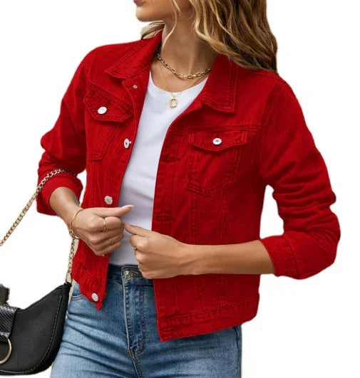 woman wearing red denim jacket over white t-shirt with blue jeans and black chain bag