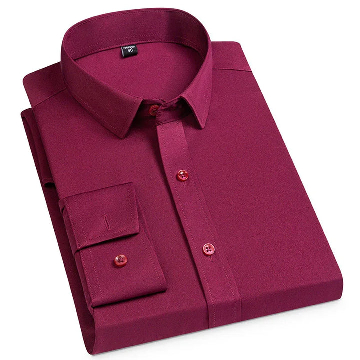 Folded men's formal burgundy dress shirt with long sleeves and buttoned cuffs
