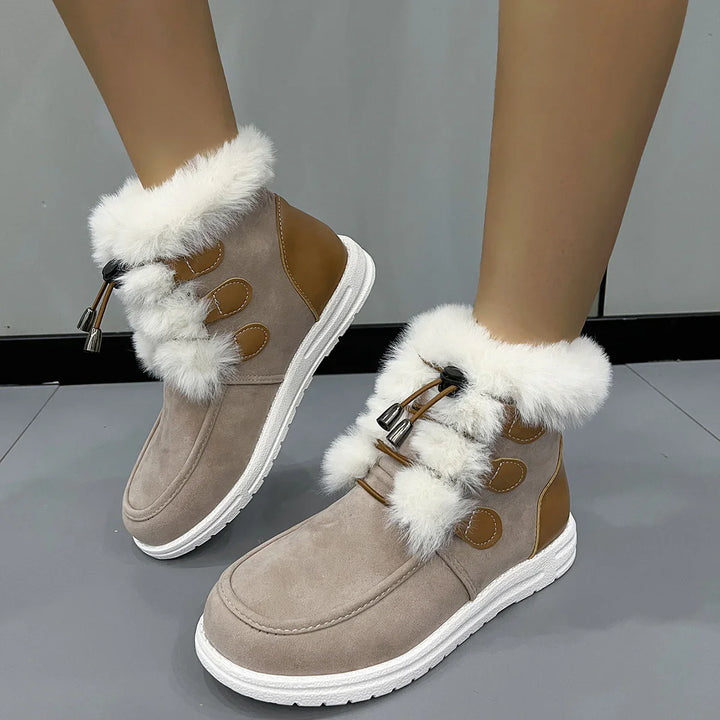 Women's winter ankle boots with white fur trim, beige suede, brown accents, and white rubber sole