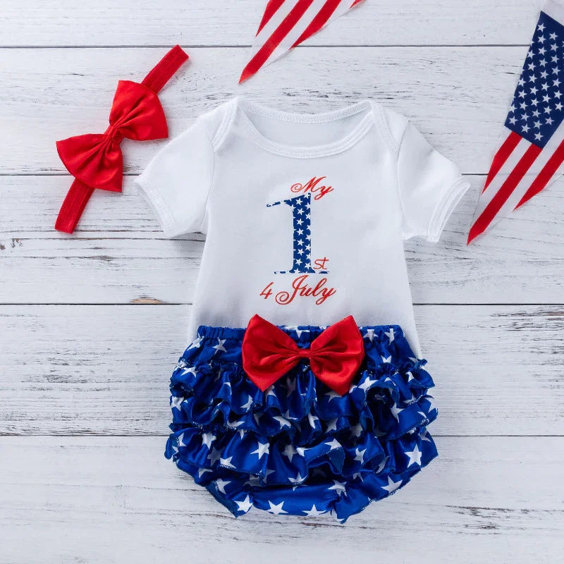 White baby onesie with My 1st 4 July text and star-spangled blue ruffled bloomers with red bow set