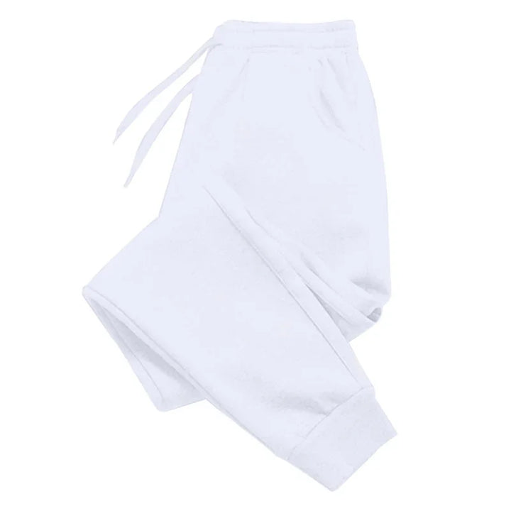 Folded plain white sweatpants with elastic waistband and drawstring, casual comfortable joggers