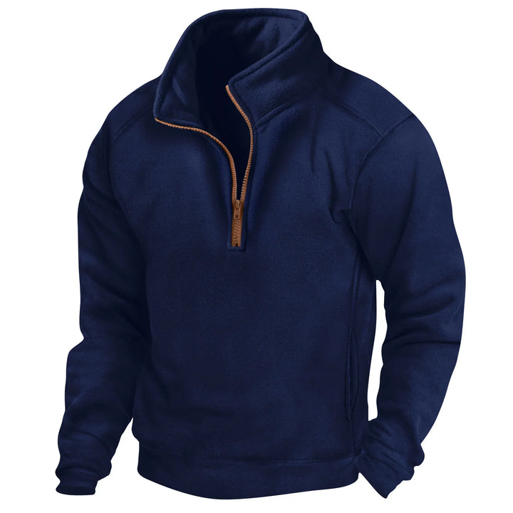 Navy blue fleece pullover with brown half-zip and high collar, long sleeves, and side pockets