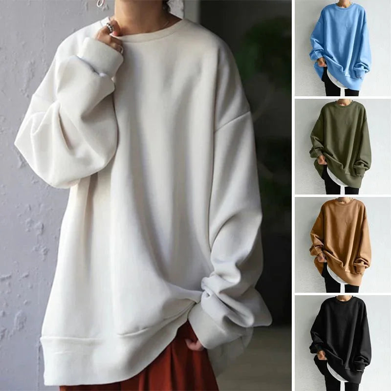 Oversized basic crewneck sweatshirts in white, blue, green, brown, and black worn with casual pants