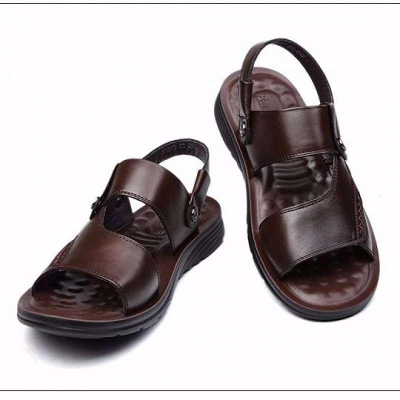 Pair of brown leather men's sandals with adjustable straps and cushioned soles on white background