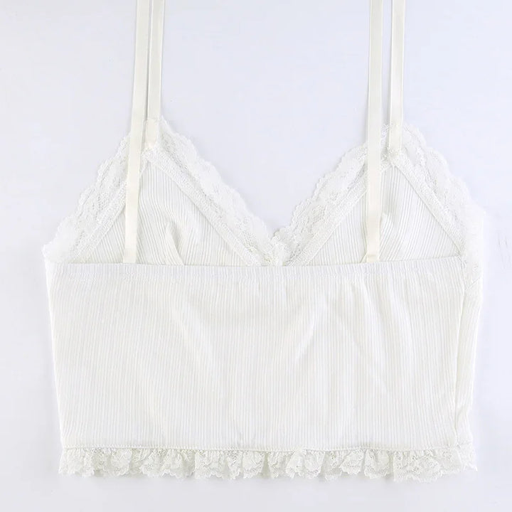 White ribbed crop top with lace trim and thin straps on a white background